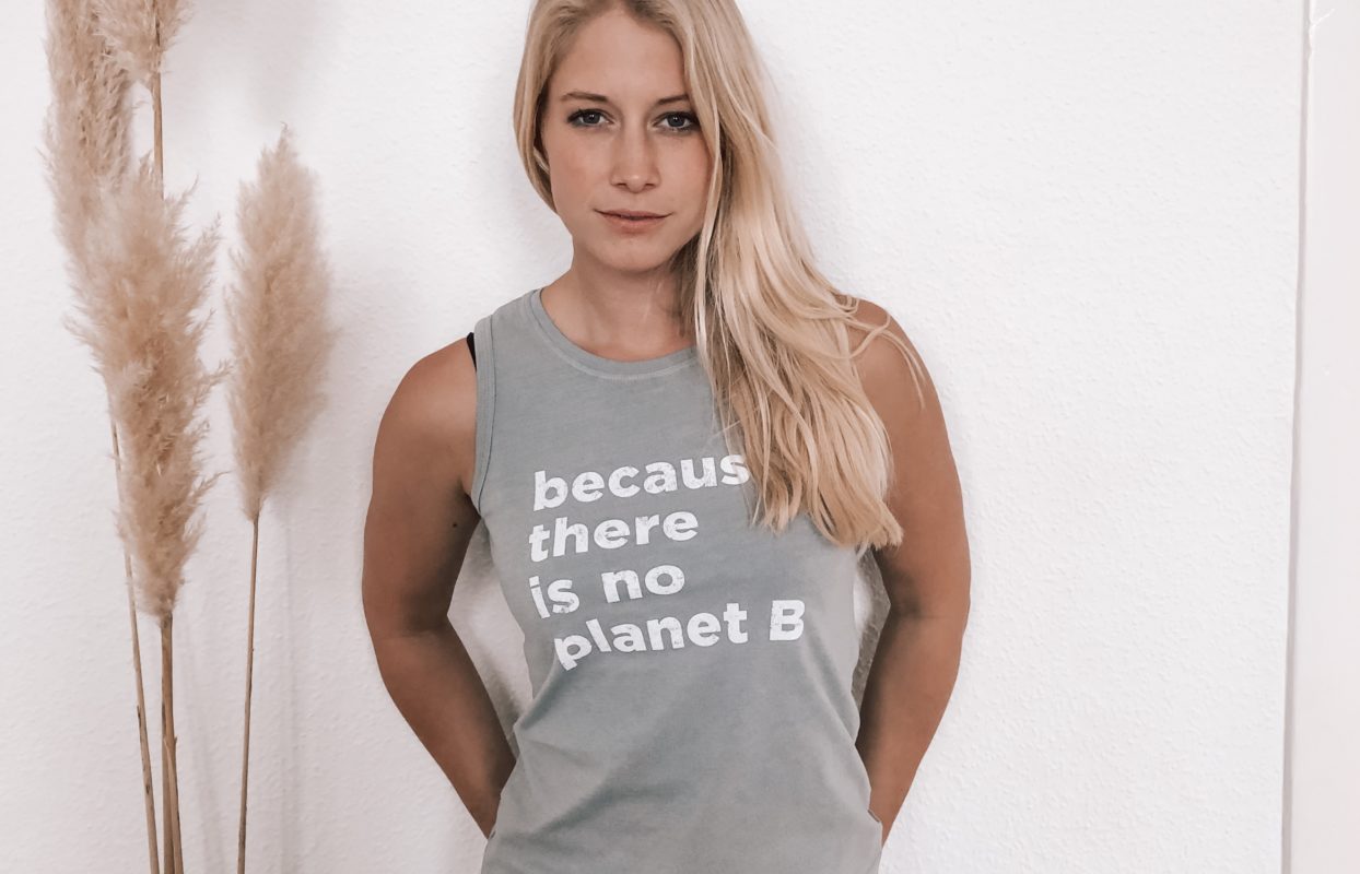 Woman wearing There is no Planet B tank top